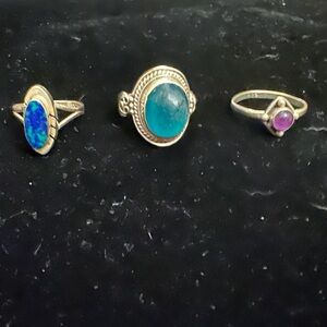 Set of three (3) sterling silver rings with stones